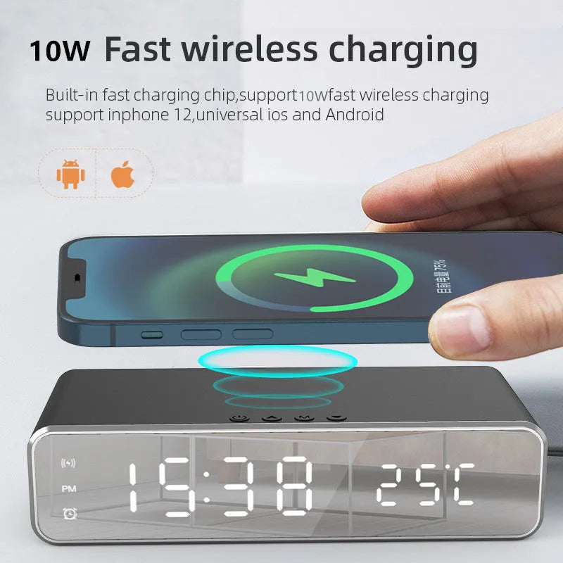 Silver wireless phone charger with clock display, thermometer reading, and integrated mirror on a desk