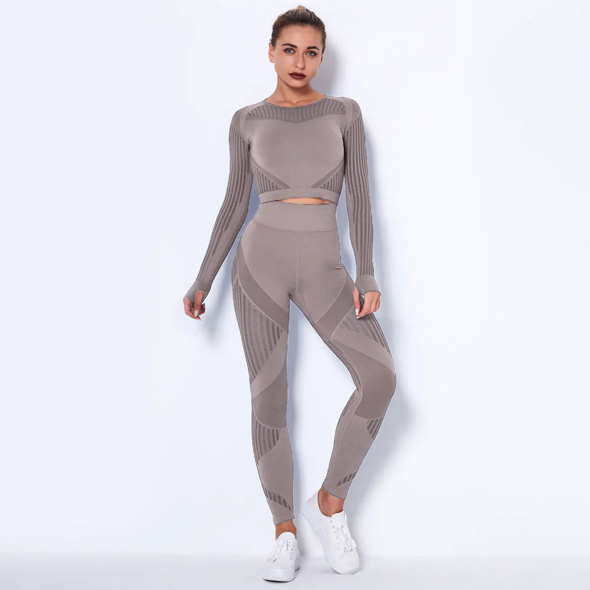 Women's black seamless knitted long-sleeved yoga wearsuit with stripe pattern, shown in a yoga pose.