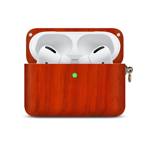 Solid wood Bluetooth earphone sleeve in bamboo colour next to wireless earphones