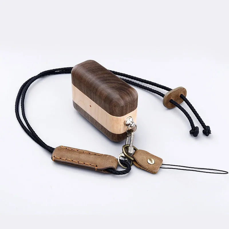 Solid wood Bluetooth earphone sleeve in bamboo colour next to wireless earphones