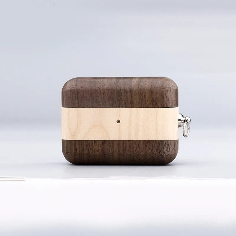 Solid wood Bluetooth earphone sleeve in bamboo colour next to wireless earphones