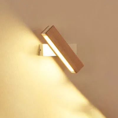 Wooden adjustable LED wall lamp in modern design with black or white finish options