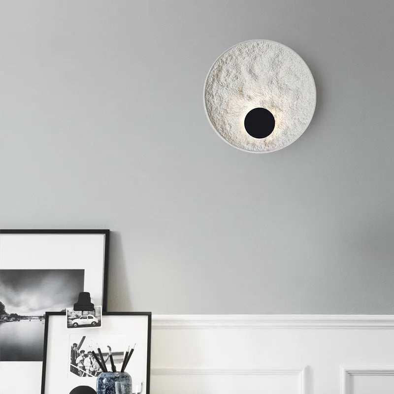 White iron wall lamp with modern digital shape in two size options for bedside lighting