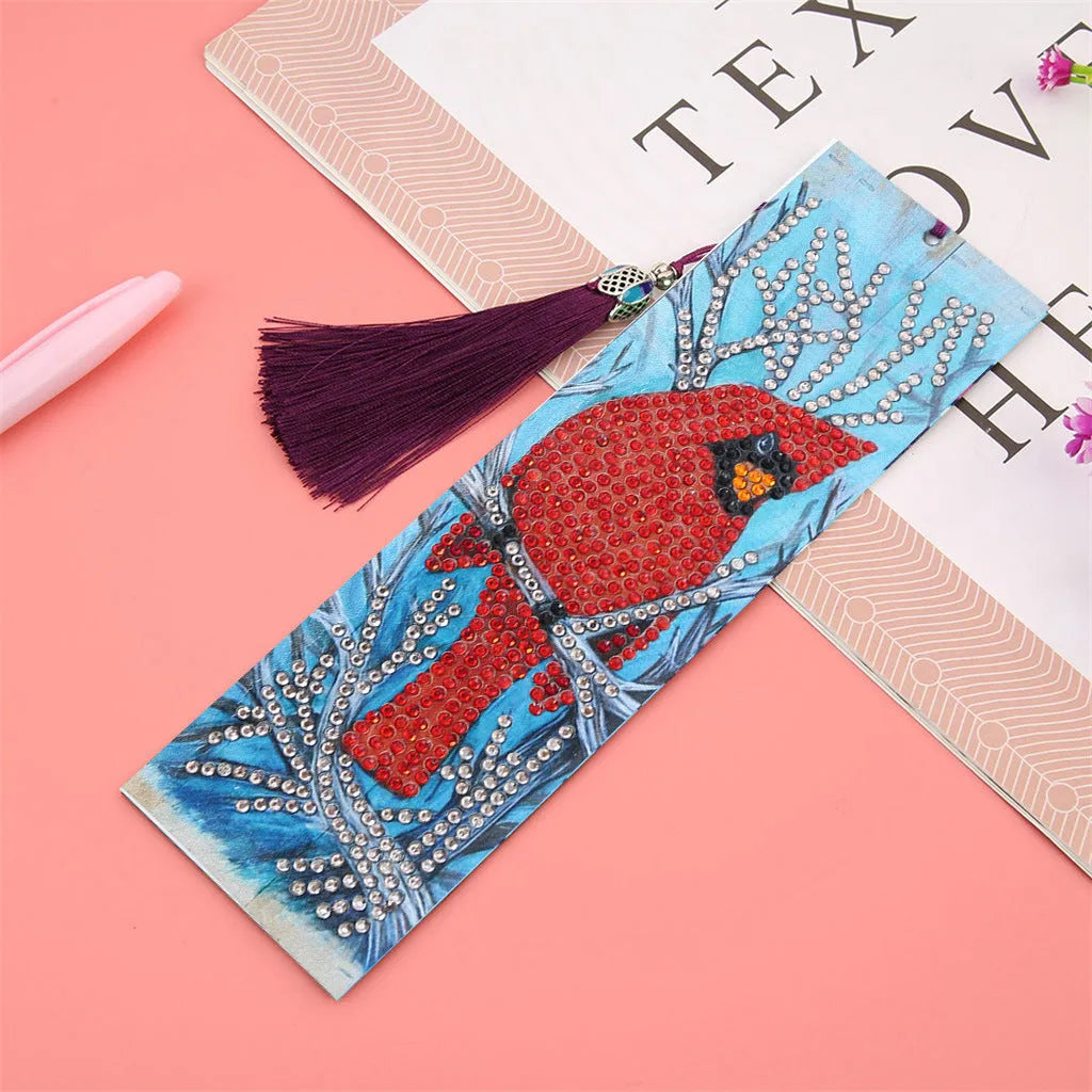 Leather diamond painting bookmark with red bird design, special-shaped diamonds, and attached pendant on a clean background