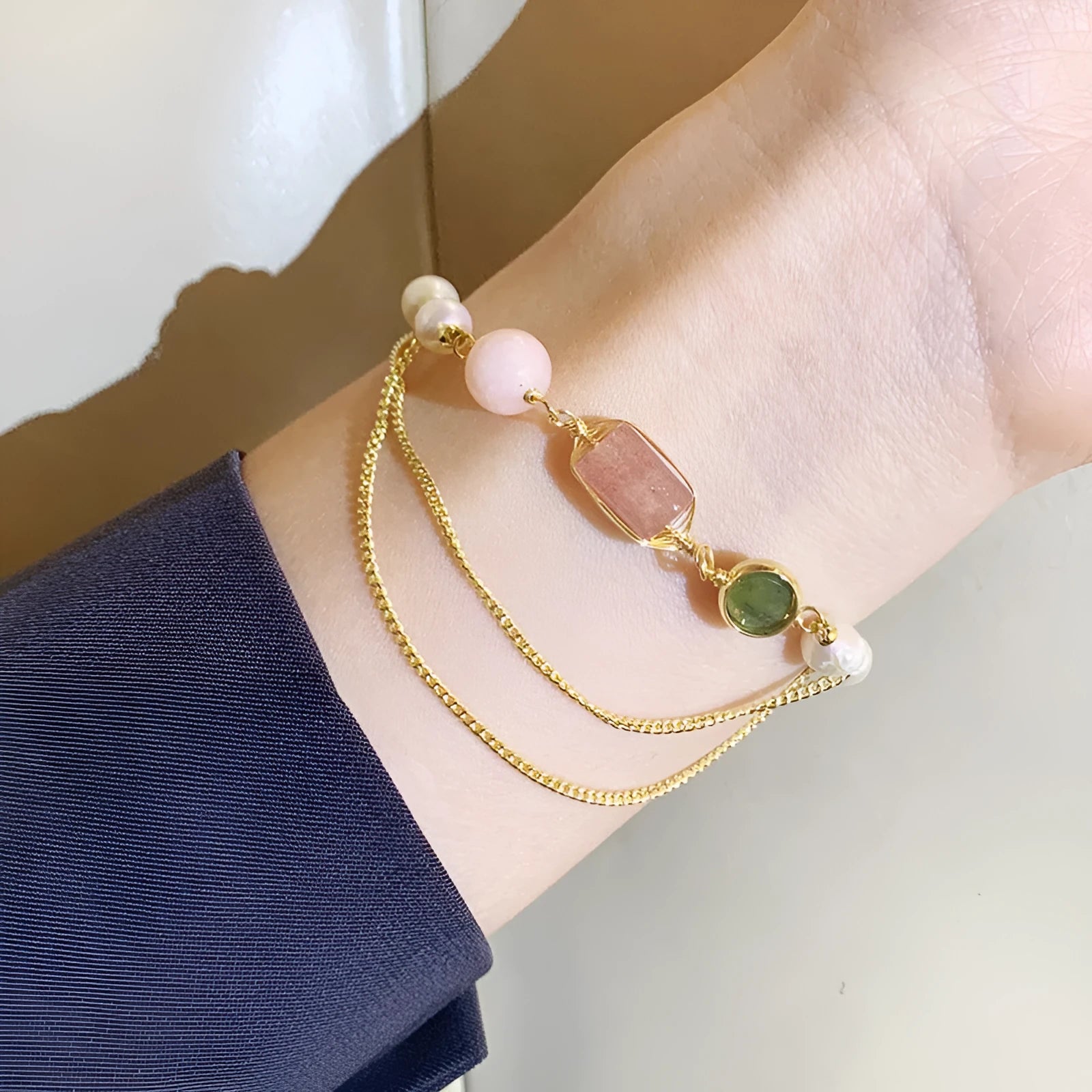 Women's pink freshwater pearl bracelet with geometric strawberry crystal design elements