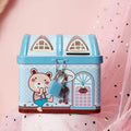 Blue house-shaped tinplate piggy bank on desktop with coin slot visible