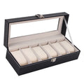 Black wooden watch display box with clear lid showing six individual watch compartments inside.