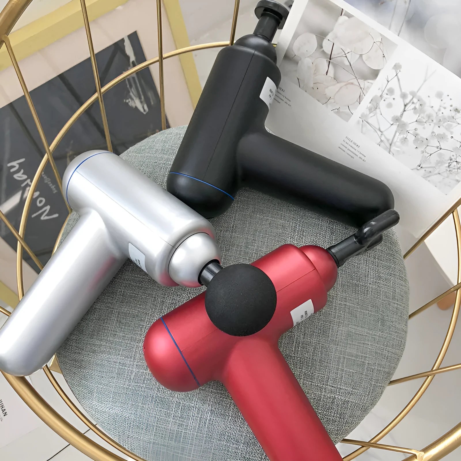 Grey handheld fascia gun massager with USB charging port for muscle relaxation therapy