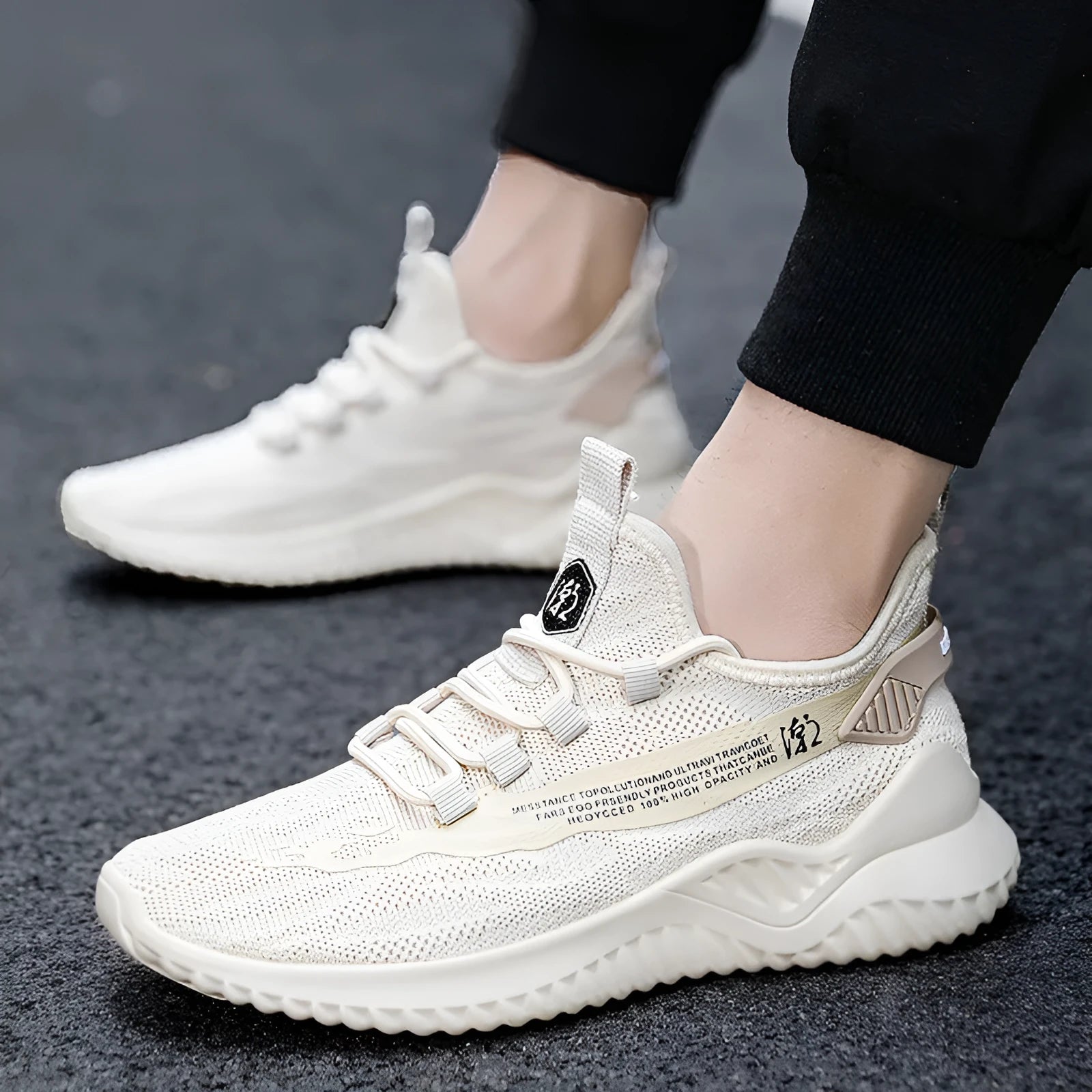 Men's low-top white mesh sports shoes with a rubber sole and front lace-up design.