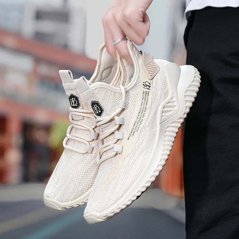 Men's low-top white mesh sports shoes with a rubber sole and front lace-up design.