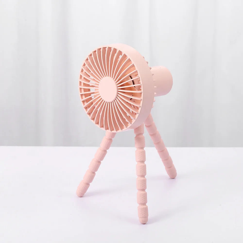 Small adjustable tripod desk fan with a bending head, shown in black, green, pink, or white.