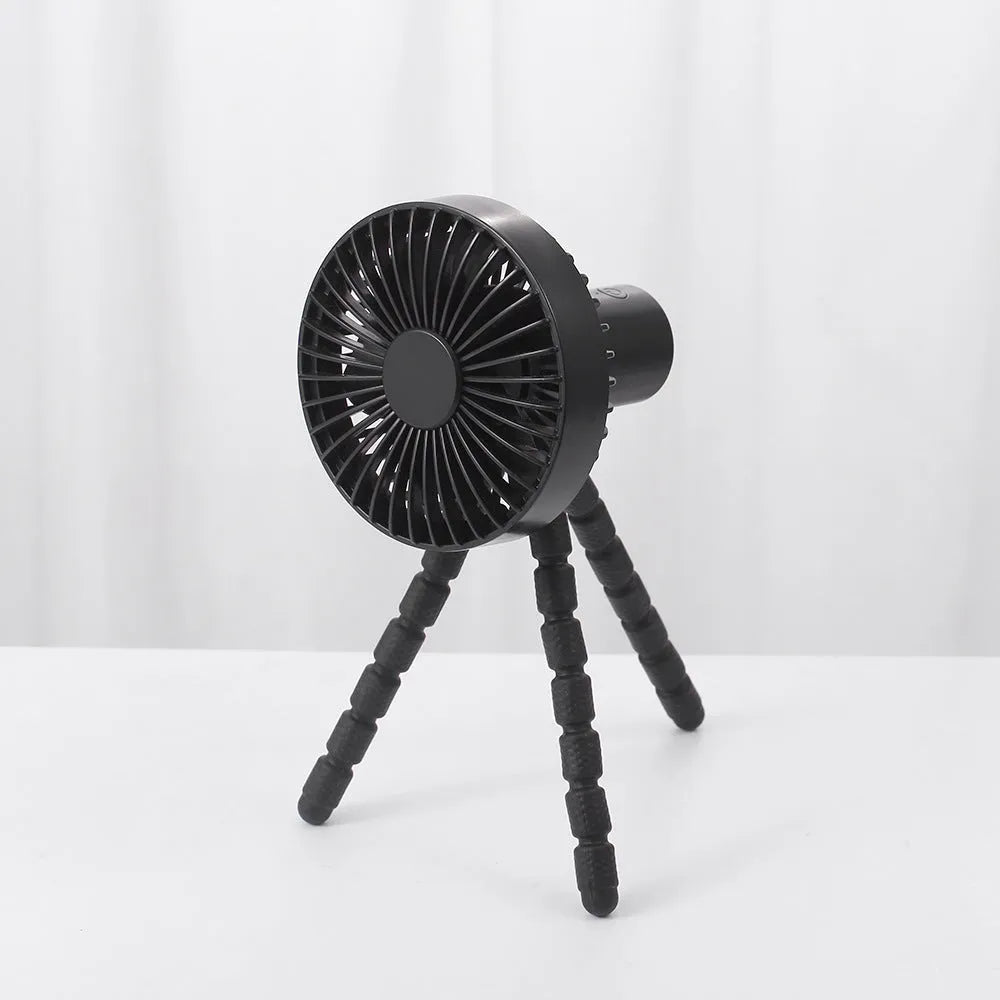 Small adjustable tripod desk fan with a bending head, shown in black, green, pink, or white.