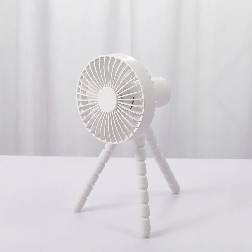 Small adjustable tripod desk fan with a bending head, shown in black, green, pink, or white.