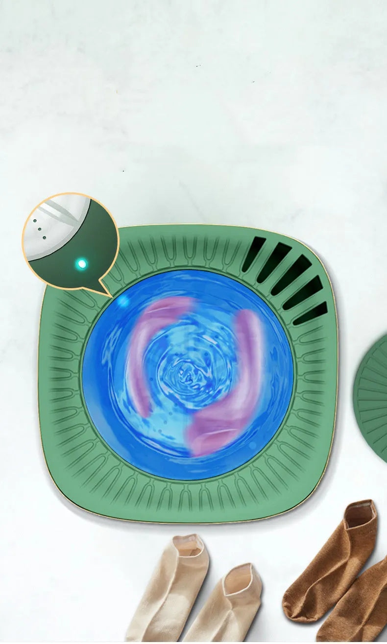 Green or white mini portable washing machine for underwear and socks on a countertop.
