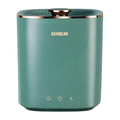 Green or white mini portable washing machine for underwear and socks on a countertop.