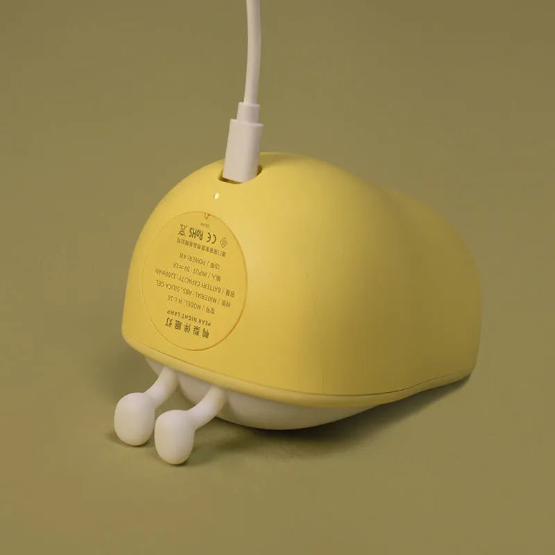 PEAR NIGHT LAMP warm yellow silicone rechargeable LED night light on bedside table, 122mm height