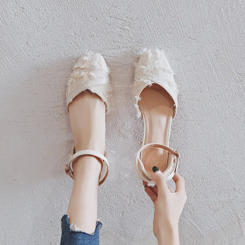 Women's apricot suede flats with an ankle strap and a low 3cm rubber sole heel.