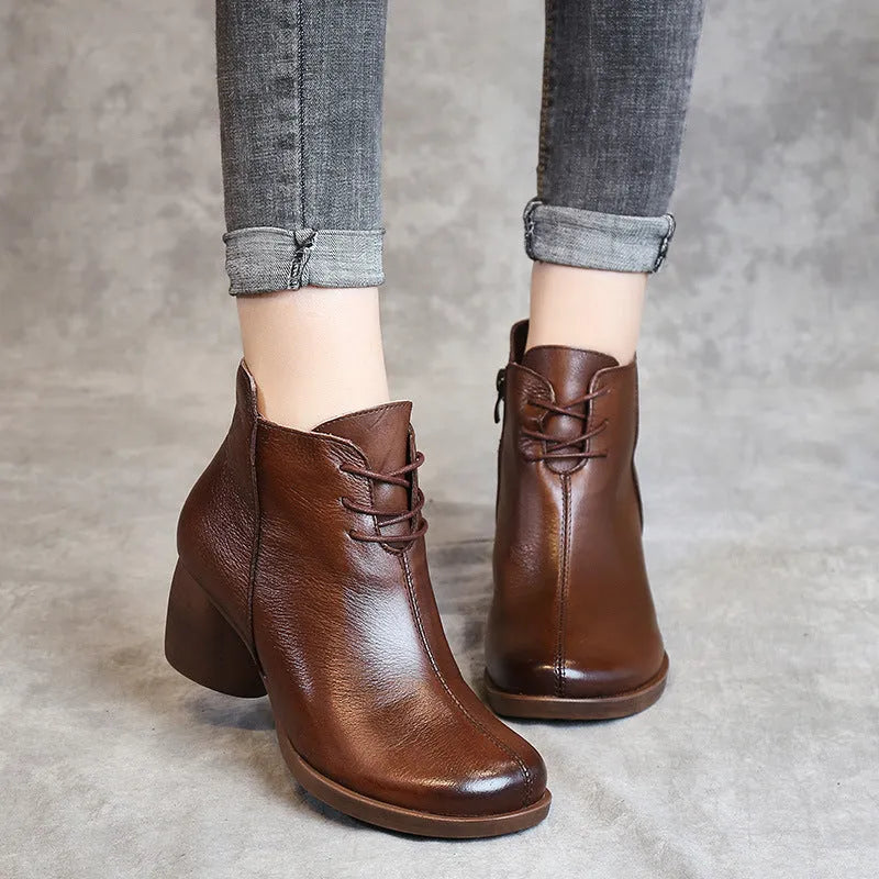 Women's black leather Martin boots with thick mid-heel and round toe design