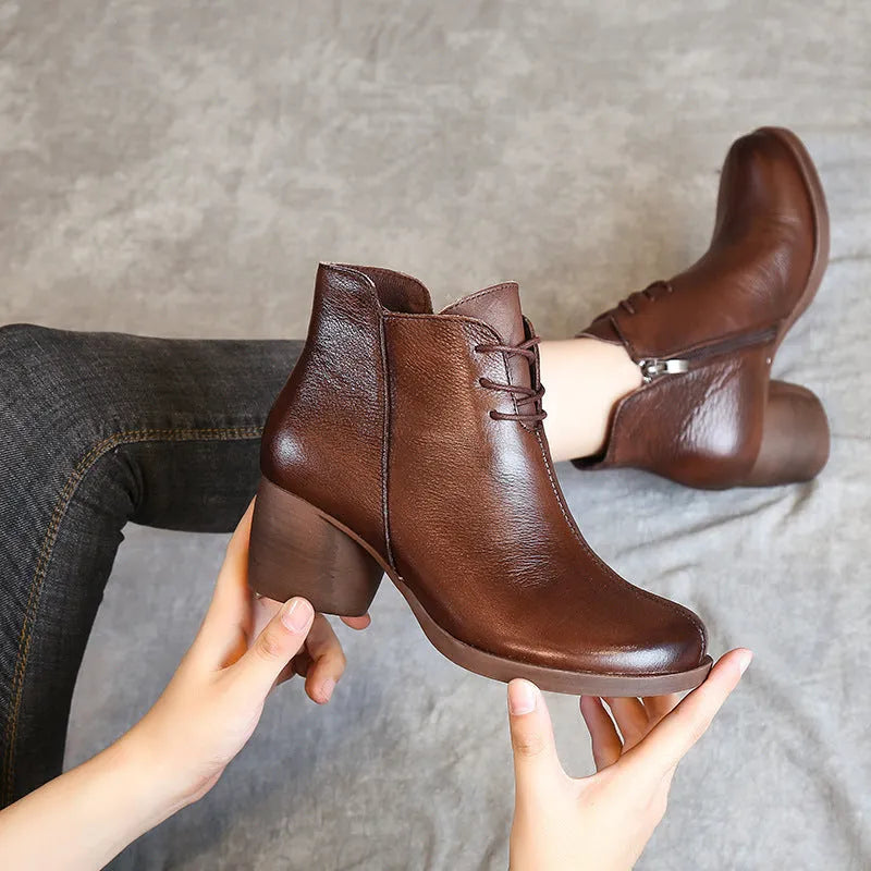 Women's black leather Martin boots with thick mid-heel and round toe design