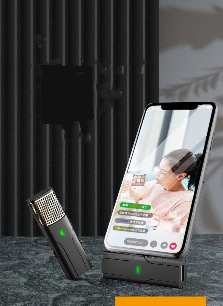 Black wireless lavalier microphone with charging cable and box for mobile phone and camera recording