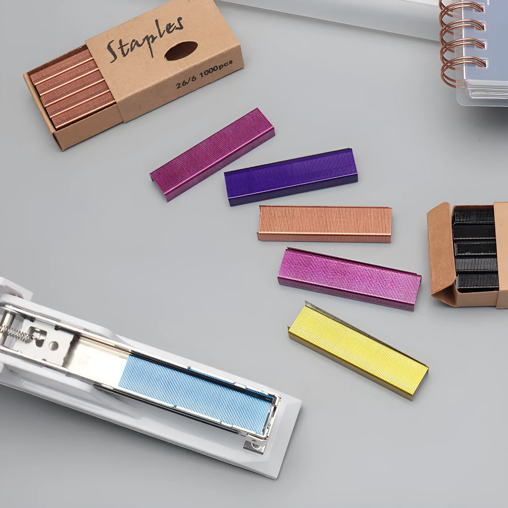 Box of 1000 metal office staples in rose gold, black, purple, and rose red colour options