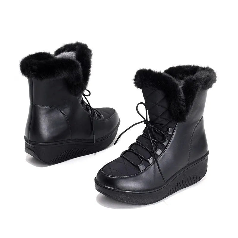 Black women's lace-up winter boots with a platform sole on a white background.