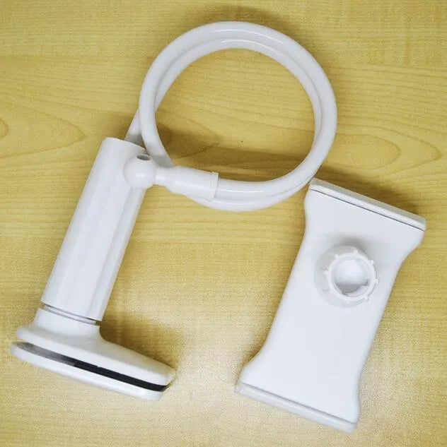 Black bedside oversize flat panel phone holder with a long flexible arm mounted on a table.
