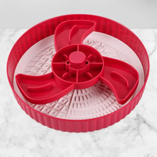 Grey plastic pet bowl with rotating windmill-pattern slow feeder licking mat inside