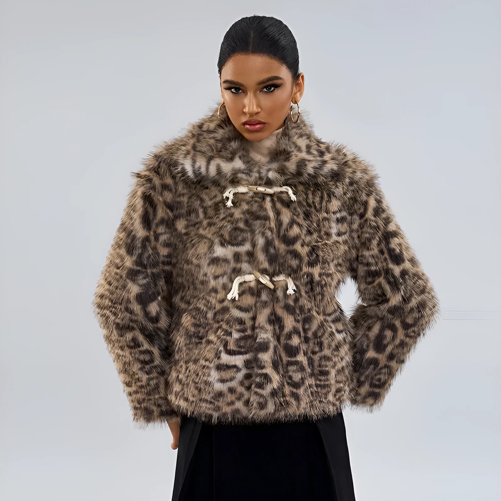 Women's leopard print coat with buckle lapel detail showing normal length street fashion design
