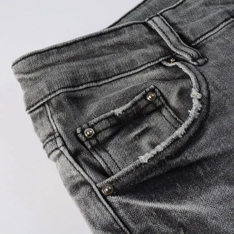 Stretch slim-fit skinny jeans in dark denim with mid waist and zip fly on a model