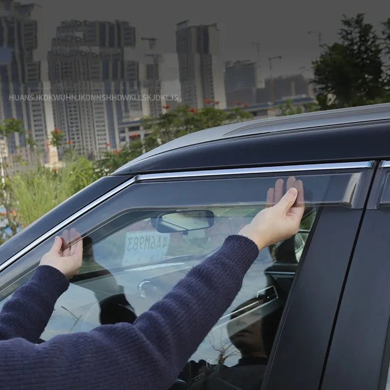2023 Mitsubishi Outlander black and translucent window deflectors mounted on vehicle