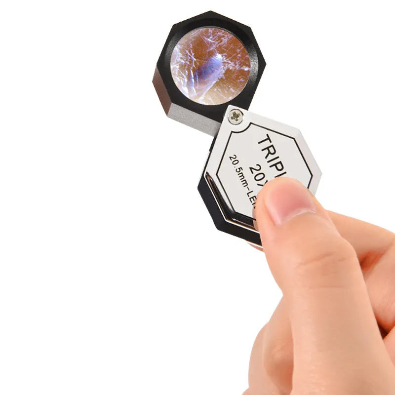 Handheld metal magnifying glass with optical glass for jewellery and coin identification at 10x to 30x magnification