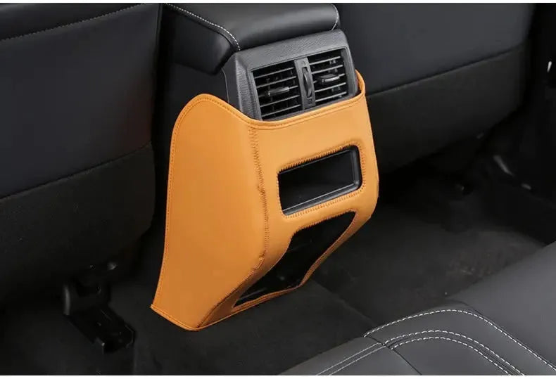 Three leather anti-kick pads for Mitsubishi Outlander seat and console protection.