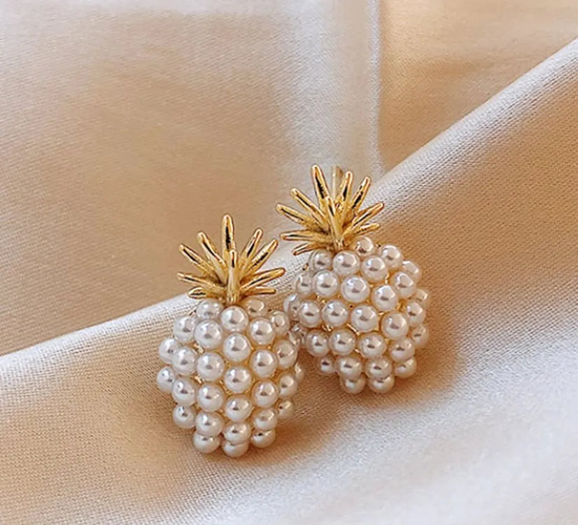 Korean-style women's drop earrings with a pineapple starfish pearl design in alloy with stone inlay.