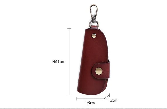 Handmade genuine leather key case for car keys in short length on a table