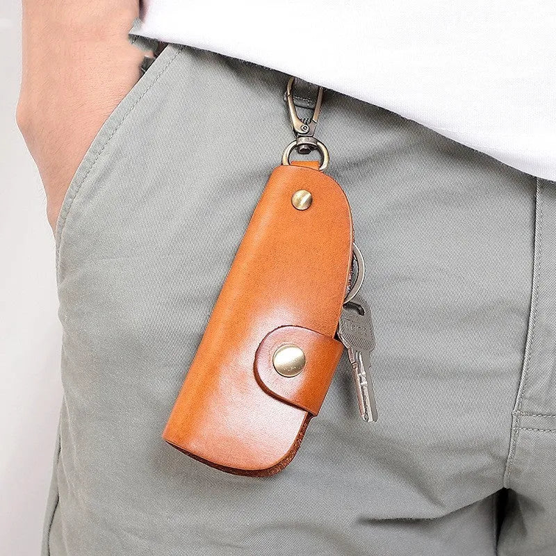 Handmade genuine leather key case for car keys in short length on a table