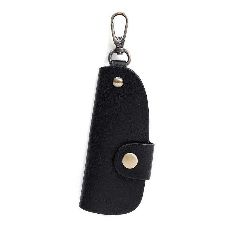 Handmade genuine leather key case for car keys in short length on a table