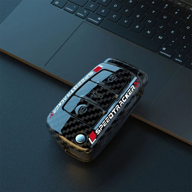 White and carbon coloured car key holders with a carbon fibre texture and mirror surface.