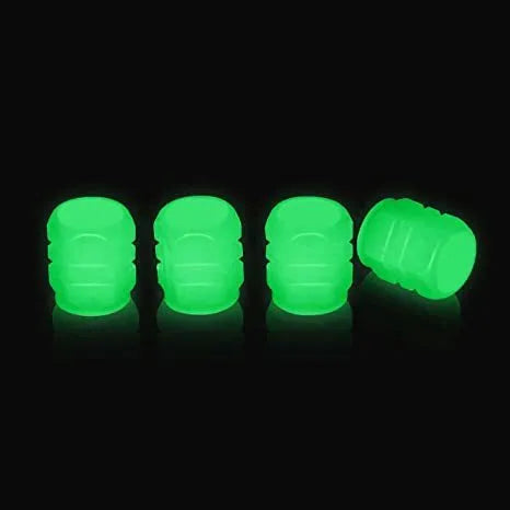 Pack of multicolour LED luminous tyre valve caps on a car wheel valve stem.