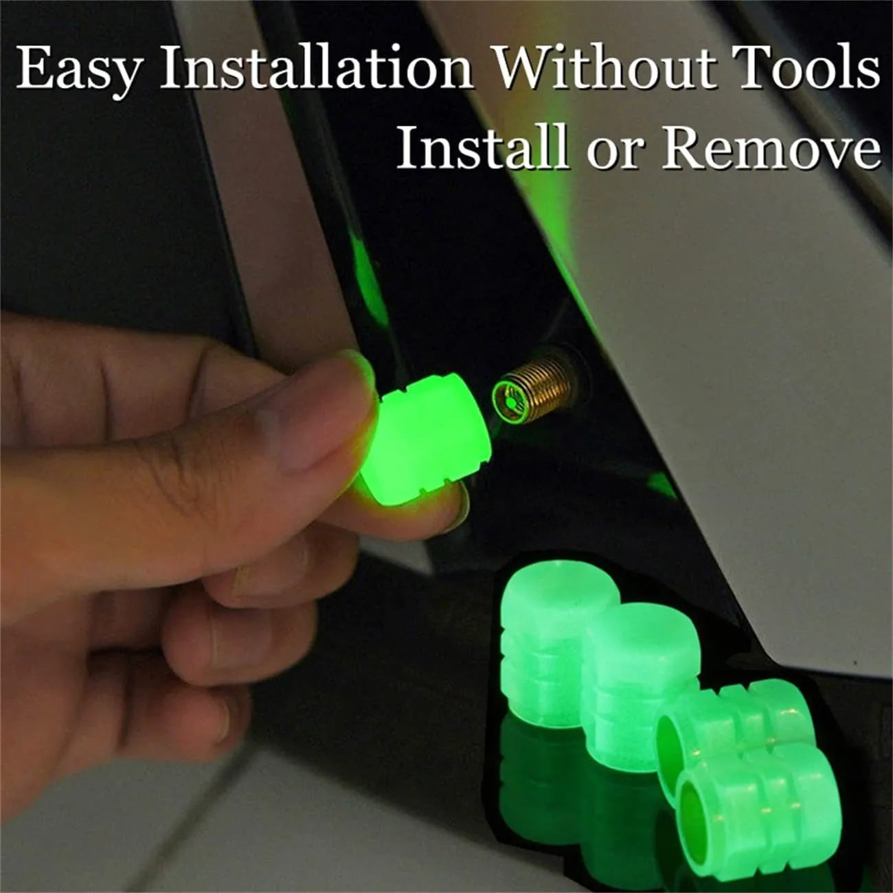 Pack of multicolour LED luminous tyre valve caps on a car wheel valve stem.