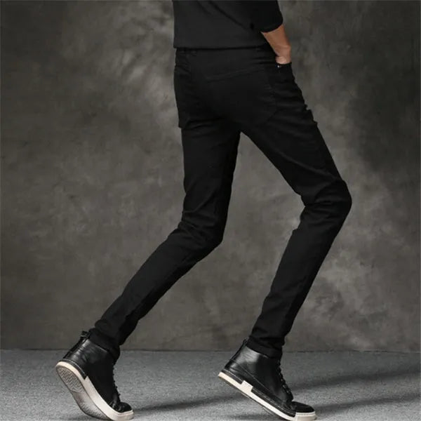 Slim-fit stretch cotton men's pants in black, laid flat showing tight cut and full length