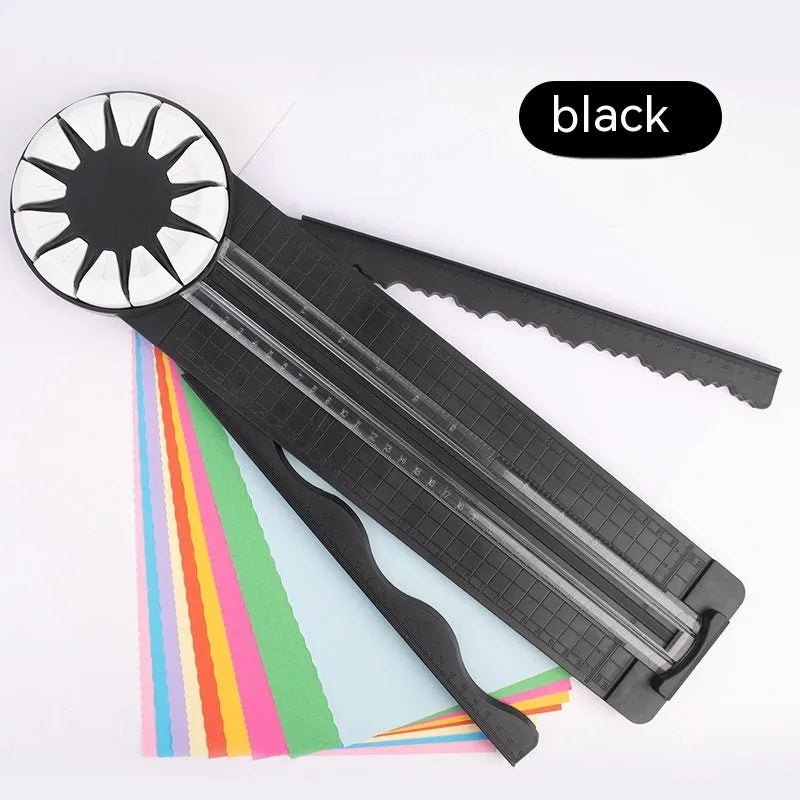 Pink plastic 12-in-1 multifunctional paper cutter with dotted guide lines on a white surface.