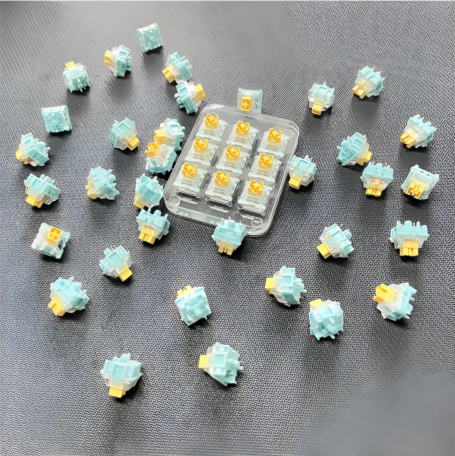 36 Tiger Mo Sea Salt Lemon PRO Mute linear silent mechanical keyboard switches arranged in a grid.