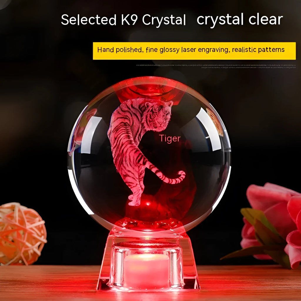 White crystal ball zodiac ornament with luminous electronic base showing Chinese zodiac animal design