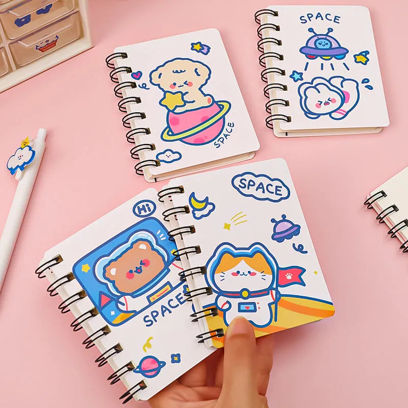 Astronaut-themed flipper notebook measuring 10.5cm by 8cm with space design cover options