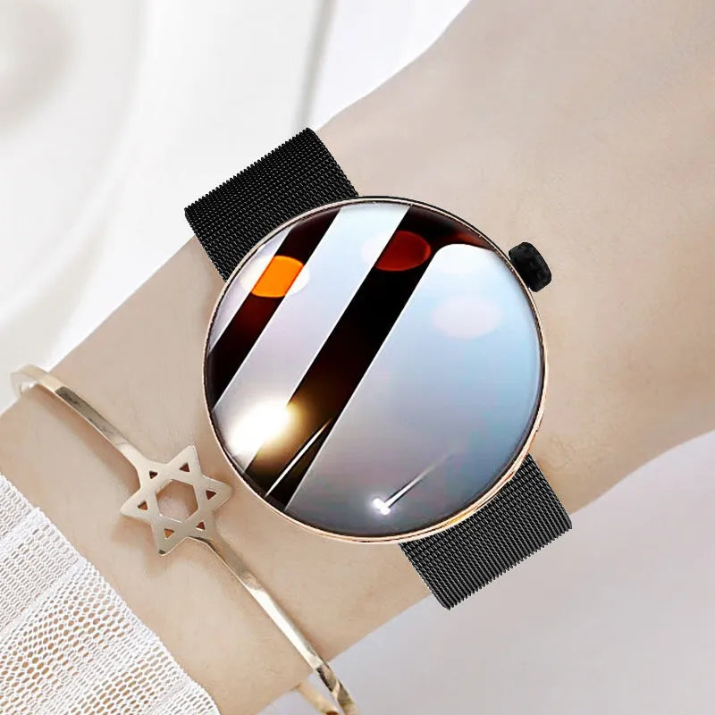 Women's smart watch with circular colour screen and metal strap on a wrist.