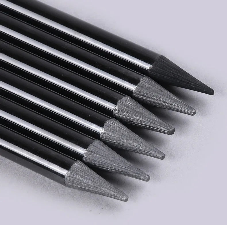 Graphite and carbonized drawing pencil set on a suction card, showing wooden-shell pencils.