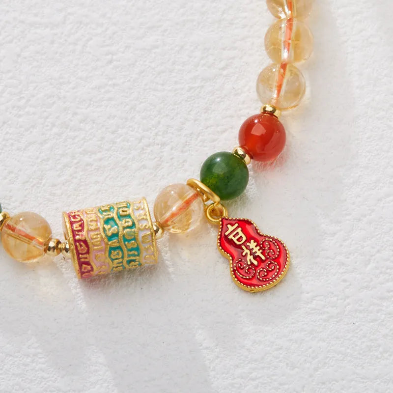 Hand-woven citrine five sutra bracelet with 6mm crystal beads on wrist