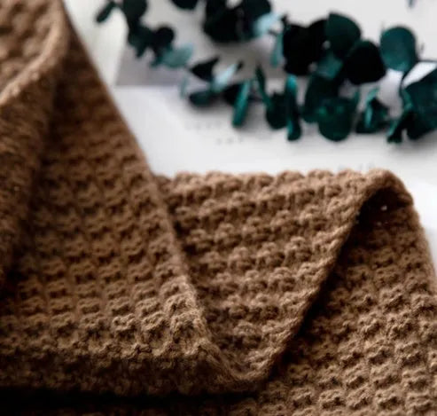 Nordic fringed knit ball blanket in beige colour showing textured design