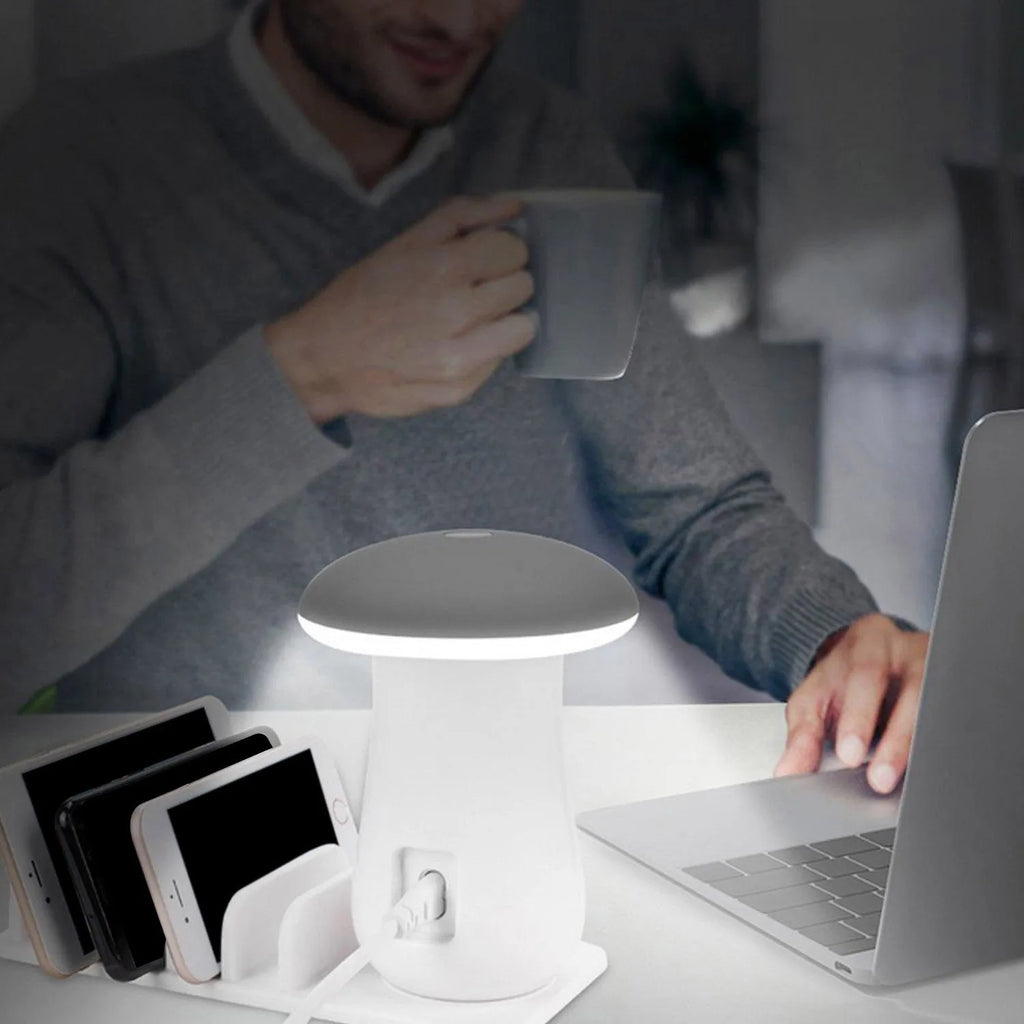 Mushroom-shaped white USB charging dock with 5 ports and integrated LED night lamp on desk